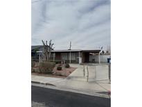 Cozy single-story home featuring a gated front yard and a covered carport for convenient parking at 1800 Atlantic St, Las Vegas, NV 89104