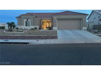 Charming single-story home with a well-manicured desert landscape and tile roof at 2736 Darby Falls Dr, Las Vegas, NV 89134
