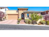Charming single-Gathering home showcasing a well-manicured yard and a welcoming two-car garage at 312 Castellari Dr, Las Vegas, NV 89138