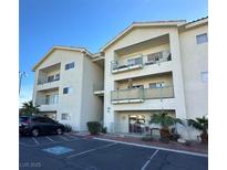 Inviting condo complex featuring balconies, well-maintained landscaping, and ample parking at 3550 Bay Sands Dr # 3089, Laughlin, NV 89029