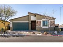 Charming single-story home featuring a well-maintained front yard and stone accents at 4227 Diya Ave, North Las Vegas, NV 89084