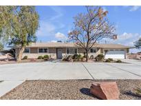 Charming single-story home featuring a large front yard and a two-car garage at 4626 W Warm Springs Rd, Las Vegas, NV 89118