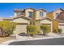 Inviting two-story home with a charming facade, dual car garage, and well-maintained landscaping at 5948 Sakhalin Ave, Las Vegas, NV 89139