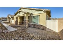Inviting single-story home with stone accents and a covered front porch at 774 Praire Plume St, Henderson, NV 89011