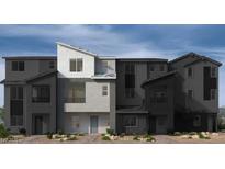 Contemporary townhome showcasing modern architecture and clean lines, perfect for urban living at 9237 Soho Sky Ct, Las Vegas, NV 89148