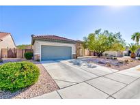 Charming single-story home featuring desert landscaping, a two-car garage, and a welcoming entrance at 2341 Rosendale Village Ave, Henderson, NV 89052
