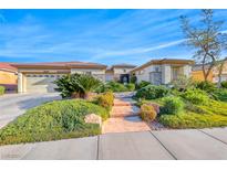 Charming single story home with a well-manicured lawn and covered three car garage at 2872 Sumter Valley Cir, Henderson, NV 89052