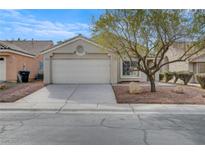 Charming single-story home featuring a two-car garage and desert landscaping at 3417 Steppe St, North Las Vegas, NV 89032