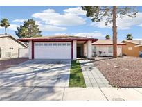 Charming single-story home featuring a two-car garage and low maintenance desert landscaping at 6325 Miraloma St, Las Vegas, NV 89108