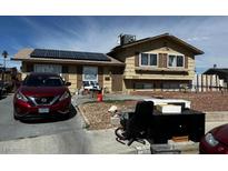 Inviting two-story home features solar panels and classic shutters at 6404 Penrose Ln, Las Vegas, NV 89107