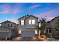 Charming two-story home featuring desert landscaping, a two-car garage, and neutral-toned stucco exterior at 6957 Antequera St, Las Vegas, NV 89149
