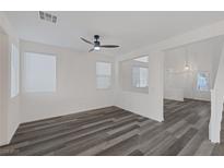 Bright living room featuring wood-style flooring and neutral walls, creating an inviting atmosphere at 8560 Lost Gold Ave, Las Vegas, NV 89129