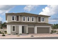 Contemporary two-story home featuring a two-car garage, neutral stucco, stone accents, and a well-manicured desert landscape at 1155 Viento View Ave, Henderson, NV 89012