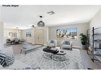 Bright living room features modern furnishings and open floor plan perfect for relaxing and entertaining at 3119 Desmond Ave, Las Vegas, NV 89121