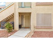 Inviting condo front door with secure screen door, stylish decor, and well-maintained surroundings at 5710 E Tropicana Ave # 1166, Las Vegas, NV 89122