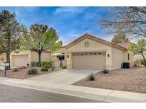 Charming single story home with a desert landscape and a two car garage at 2015 Sun Cliffs St, Las Vegas, NV 89134