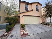 Charming two-story home featuring a two-car garage and well-maintained landscaping at 5661 Bonds Flat St, Las Vegas, NV 89148