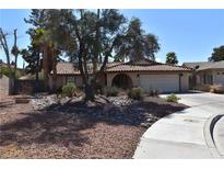 Charming single-story home with a desert-landscaped front yard and a two-car garage at 595 Chelsea Dr, Henderson, NV 89014