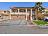Charming two-story home featuring an inviting front yard and a two car garage at 6578 Chimes Tower Ave, Las Vegas, NV 89139