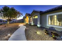 Charming single-story home with desert landscaping, and a welcoming walkway at 1630 Sundown Dr, Henderson, NV 89002