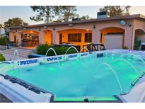 Inviting pool and spa featuring beautiful fountains and lighting for the ultimate outdoor retreat at 3132 El Camino Rd, Las Vegas, NV 89146