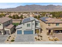 Beautiful two-story home with a three car garage and solar panels in a neighborhood near mountains at 4040 Beech Fern Ave, North Las Vegas, NV 89084