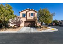Charming two-story home featuring a well-maintained lawn, beautiful landscaping, and an attached two-car garage at 4982 Mountain Pepper Dr, Las Vegas, NV 89148