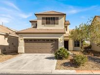 Charming two-story home with a well-manicured front yard and a two-car garage at 5120 First Sun St, North Las Vegas, NV 89081