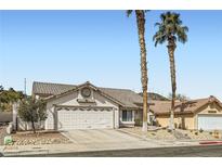 Inviting single-story home with a well-maintained yard and two-car garage at 841 Rusty Anchor Way, Henderson, NV 89002