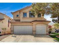 Charming two-story home with a three-car garage and a well-maintained front yard at 947 Rainbow Rock St, Las Vegas, NV 89123