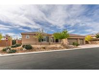 Charming single-story home featuring desert landscaping, a three car garage and a tile roof at 9731 Addie Meadow Ct, Las Vegas, NV 89149