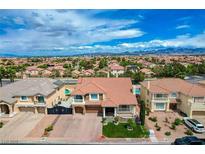 An appealing two-story home featuring a well-maintained front yard and a three-car garage at 11072 Pentland Downs St, Las Vegas, NV 89141