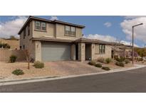 Charming two-story home with a two-car garage and manicured front yard at 12346 Valley Chase Ave, Las Vegas, NV 89138