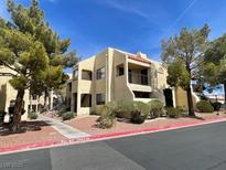 Attractive condo building with balconies and well-maintained landscaping on a sunny day at 601 Cabrillo Cir # 970, Henderson, NV 89015