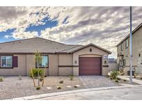 Charming single-story home with a well-manicured front yard and a two-car garage at 7910 Pandora Sky St # 271, North Las Vegas, NV 89084