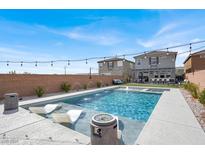 Inviting in-ground pool with lounge chairs, perfect for relaxation and outdoor enjoyment at 8312 Pollenzo Ave, Las Vegas, NV 89178