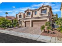 Charming stucco two-story home featuring a three-car garage, tile roof and a well-maintained landscaped yard at 9967 Pipestone St, Las Vegas, NV 89141
