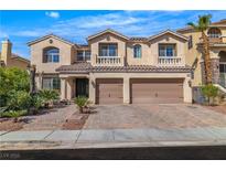 Charming two-story home with a two-car garage and beautifully landscaped front yard in a sunny neighborhood at 9967 Pipestone St, Las Vegas, NV 89141