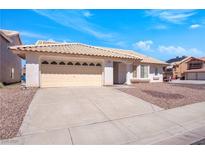 Charming single-story home with a desert landscape and a two-car garage, perfect for suburban living at 2802 Via Avanti St, Henderson, NV 89074