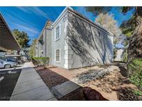Two-story condo building with well-maintained landscaping and covered parking at 3823 S Maryland Pkwy # T8, Las Vegas, NV 89119