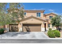 Beautiful two-story home with a three-car garage and a well-maintained front yard at 6656 Fort William St, North Las Vegas, NV 89084