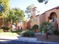 Lovely condo complex with mature landscaping and inviting walkways at 9325 W Desert Inn Rd # 110, Las Vegas, NV 89117
