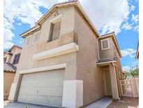 Charming two-story home featuring an attached two-car garage and a neutral color scheme at 4107 Macadamia Dr, Las Vegas, NV 89115