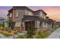 Charming multi-story home with well-manicured front yard and welcoming entrance at 6208 Rathbone St, Las Vegas, NV 89166