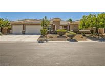 Charming single-story home featuring a neutral color palette, tile roof, two car garage, and well manicured landscaping at 6527 Lokai Ave, Las Vegas, NV 89130