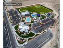 Aerial view showcases Skye Canyon Park's amenities including pool, sports field, fitness center, and bistro at 8564 Scalpay St, Las Vegas, NV 89166
