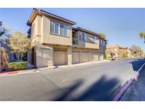 Attractive condo building with multiple garages and manicured landscaping at 3915 Palm Beach St # 201, Las Vegas, NV 89129