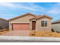 Charming single-story home featuring a two-car garage, low maintenance desert landscaping, and a terracotta roof at 6737 Lotus Vista Ct, Las Vegas, NV 89156