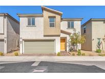 Inviting two-story home with a neutral color scheme and a two-car garage at 6952 Crimson Shadow St, North Las Vegas, NV 89086