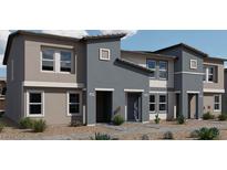 Charming townhomes with modern architecture and desert landscaping create an inviting curb appeal at 7405 Harmon Falls Ct # 1093/226, North Las Vegas, NV 89084